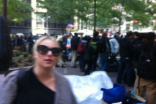 The lady in question, in a blurry self-tweeted photo from Zuccotti Park